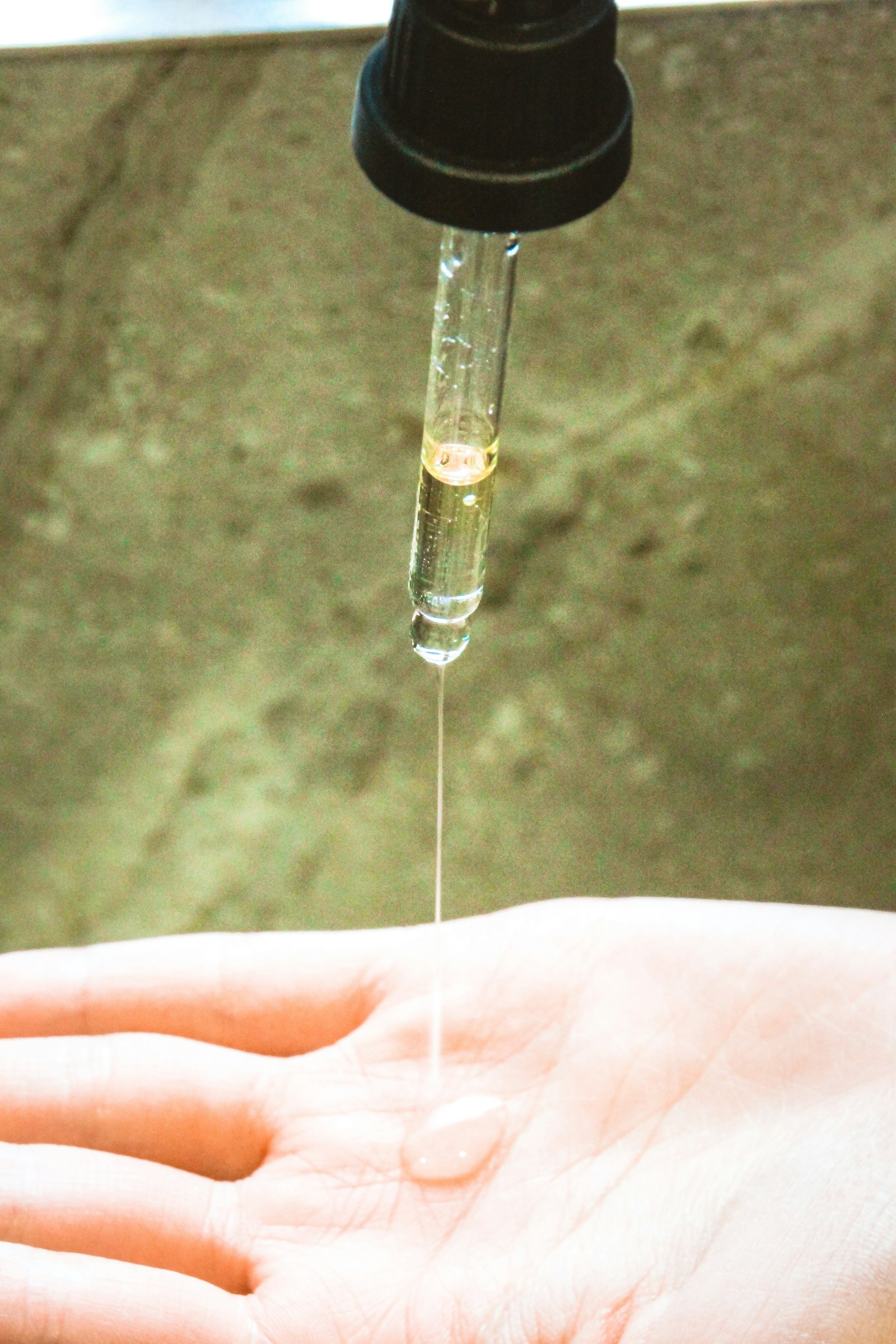 A drop of serum above a hand