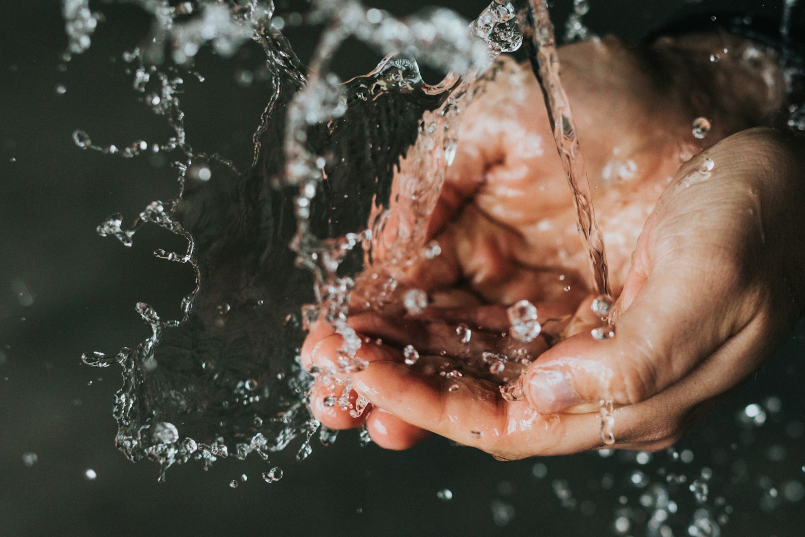 Hands being rinsed in fresh water