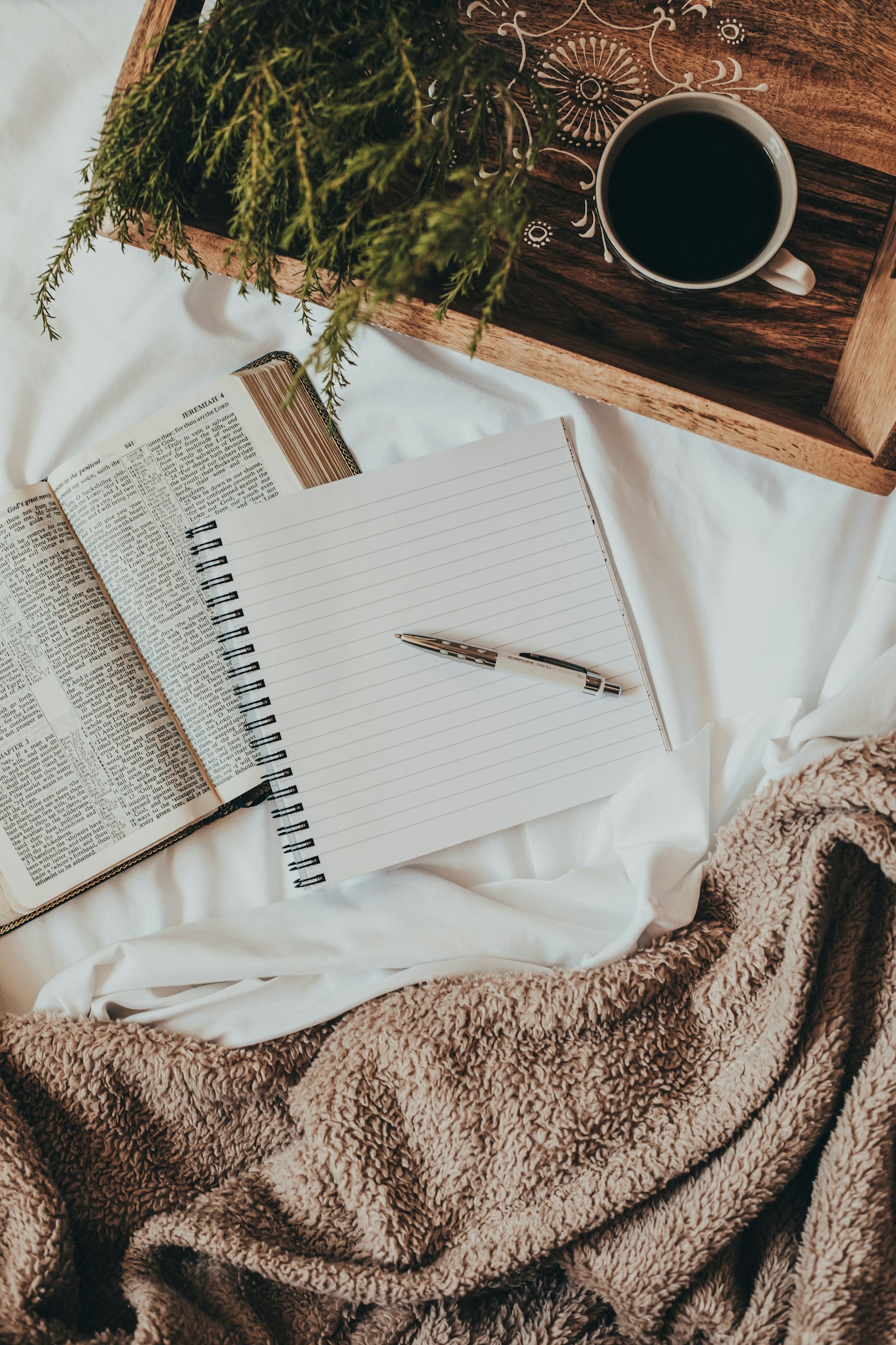 An open notebook on soft fabric