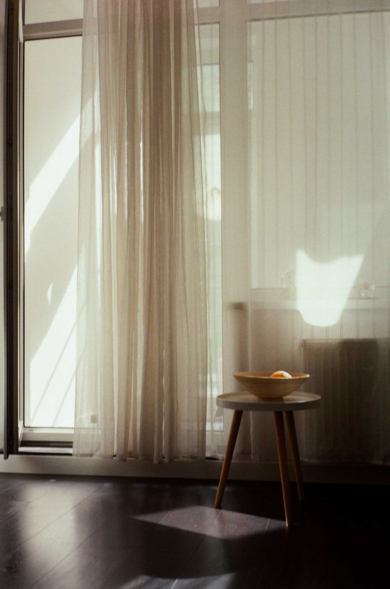 Morning light falling through linen curtains