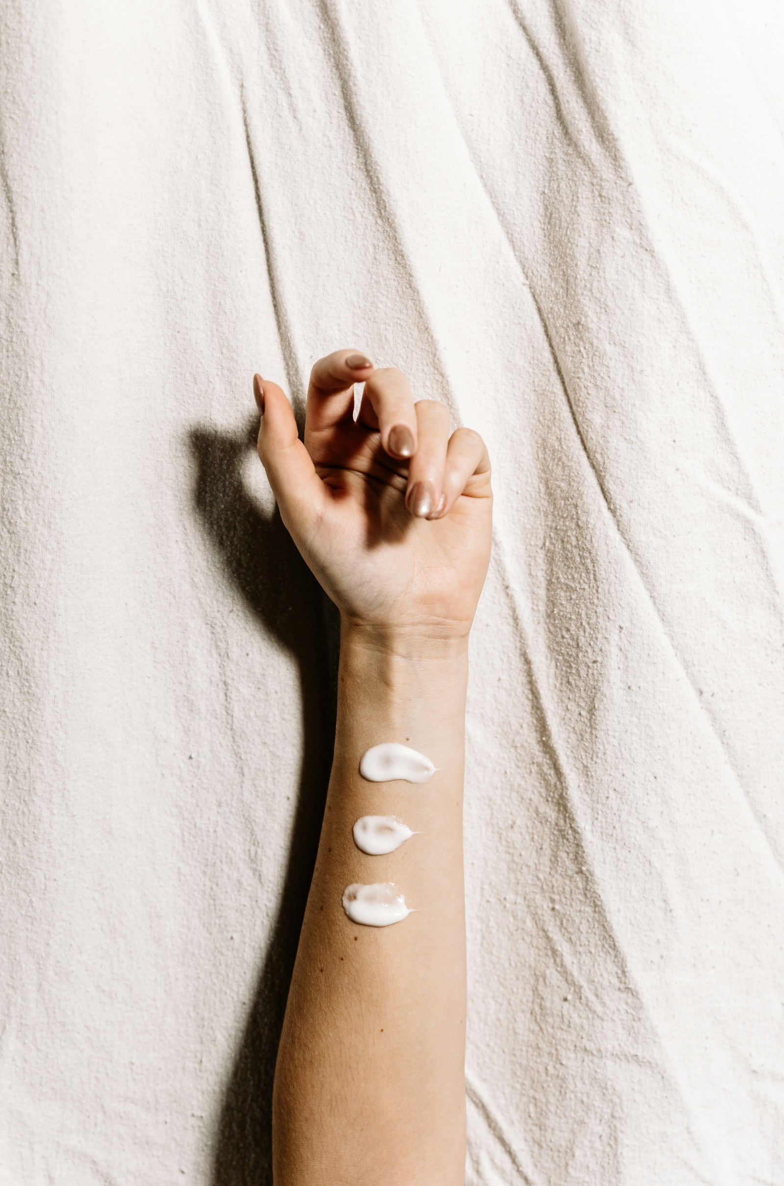 Skincare cream on a forearm in natural light